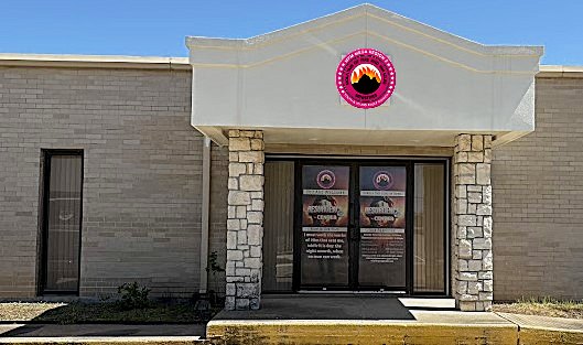 MFM Resurgence Center building, Houston — pink emblem over the entrance